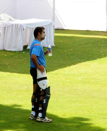 Gambhir watches his team-mates practice from the sidelines