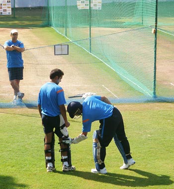 Tendulkar teaches Gambhir on how use his feet while playing the short delivery as coach Gary Kirsten watches from a distance