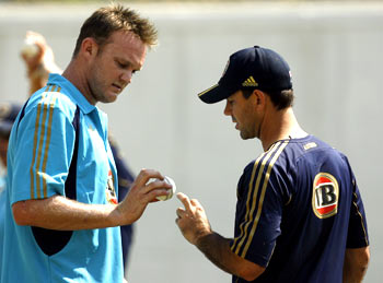 Ricky Ponting shares a few notes with Doug Bollinger during practice on Tuesday