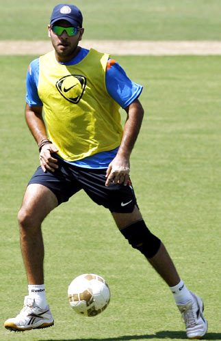 Yuvraj Singh plays football during a practice session on Tuesday