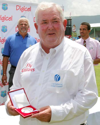 Umpire David Shepherd from England displays his match medal in Jamaica