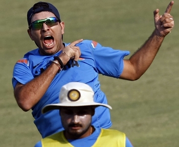 Yuvraj Singh celebrates after scoring in a football session at practice