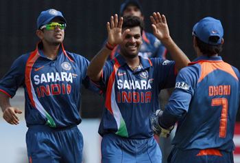 RP Singh is congratulated by team-mates