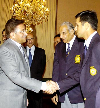 Pakistan president Pervez Musharraf (left) greets Indian captain Rahul Dravid as team manager Raj Singh Dungarpur looks on