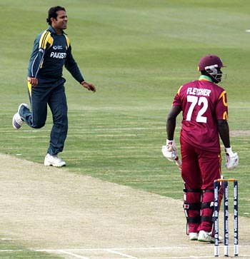 Naved-ul-Hasan celebrates the wicket of Andre Fletcher at an Indian Cricket League match.