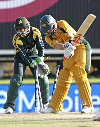 Pakistan's Kamran Akmal looks on as Australia's Callum Ferguson is bowled
