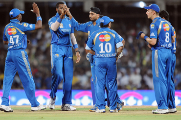 Mumbai Indians' players celebrate a wicket