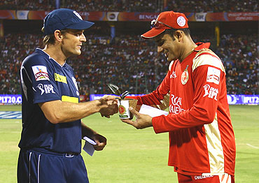 Adam Gilchirst is presented with a plant from Anil Kumble before the toss