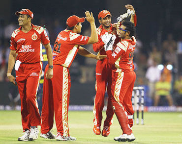 Bangalore players celebrate after a wicket