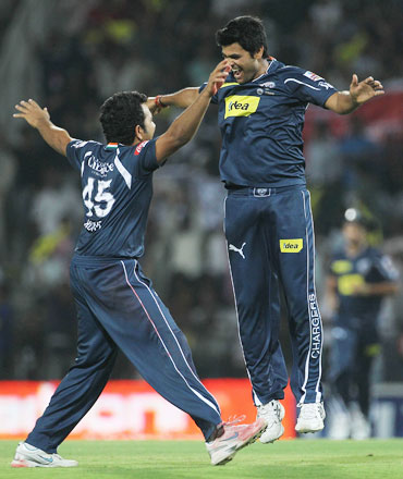 RP Singh and Rohit Sharma celebrates after picking up a wicket