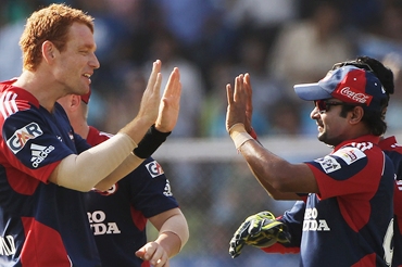 Andrew McDonald and Amit Mishra celebrate the wicket of Chandan Madan