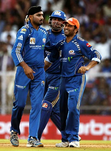 Harbhajan Singh celebrates with team mates after taking the wicket of Gautam Gambhir
