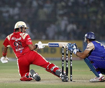 Robin Uthappa is stumped by Rajasthan Royals wicketkeeper Naman Ojha
