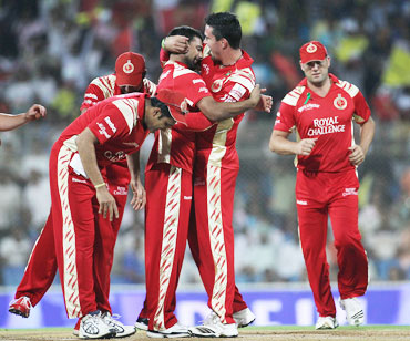 Praveen Kumar celebrates with team-mates