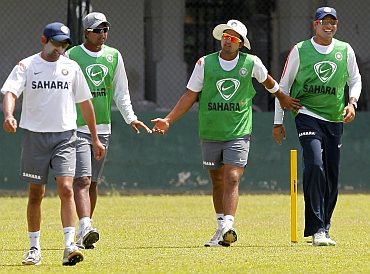 Indian team players walk back after a practice session
