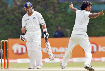 Sri Lanka's Lasith Malinga (right) successfully appeals for the wicket of India's Sachin Tendulkar