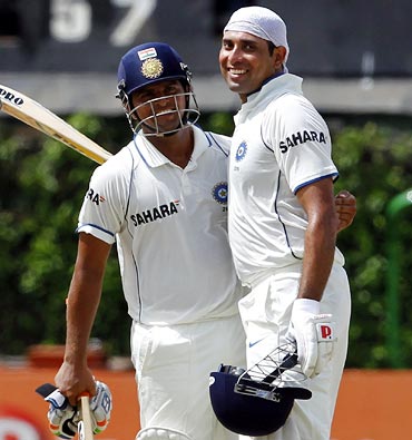 VVS Laxman (right) celebrates with Suresh Raina