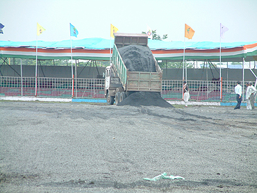 A truck-load of gravel is emptied on the Madhavrao Scindia Cricket Ground
