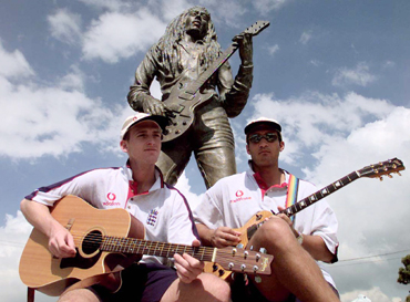 England cricketers John Crawley and Mark Butcher (right) play their guitars in front of Bob Marley