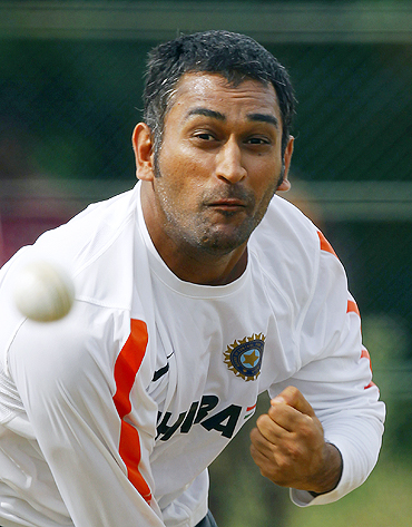 Indian skipper Mahendra Singh Dhoni bowls in the nets during a practice session on Monday