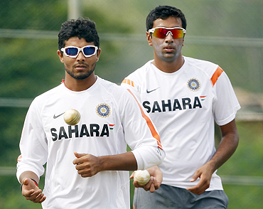 India's Ravindra Jadeja (left) and R Ashwin await their turn to bowl during a practice session on Monday