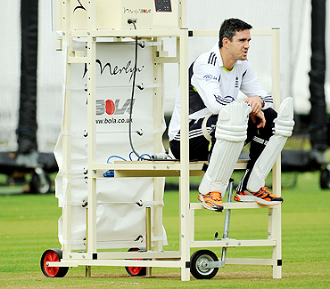 England's Kevin Pietersen sits on a bowling machine during a training session at Lord's cricket ground in London on Wednesday