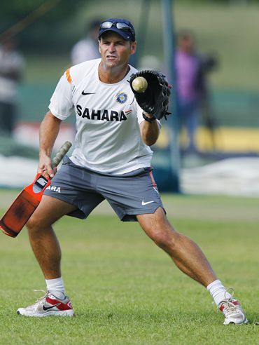 India coach Gary Kirsten catches a ball with a baseball glove as he runs through drills