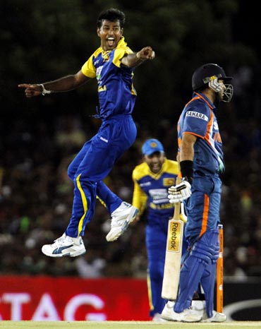 Nuwan Kulasekara (left) unsuccessfully appeals for the wicket of Yuvraj Singh
