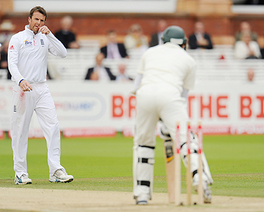 England's Graeme Swann (left) looks on after bowling Pakistan's Azhar Ali on the fourth day of the fourth Test on Sunday