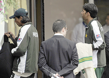Pakistan cricketers Mohd Aamir (left) and Mohd Asif arrive at the team hotel after their team's defeat against England on Sunday