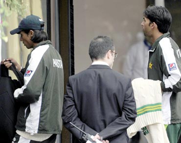 Mohammad Amir (left) and Mohammad Asif arrive at the team hotel