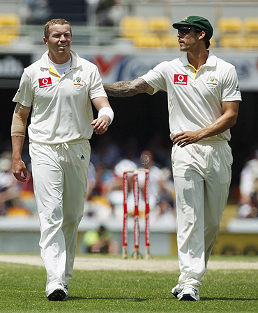 Australian bowlers Peter Siddle (left) and Mitchell Johnson