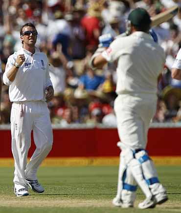 Graeme Swann celebrates after picking up Ryan Harris during the second Ashes Test in Adelaide