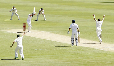 England's Andrew Strauss is bowled by Australia's Doug Bollinger (right) on Saturday