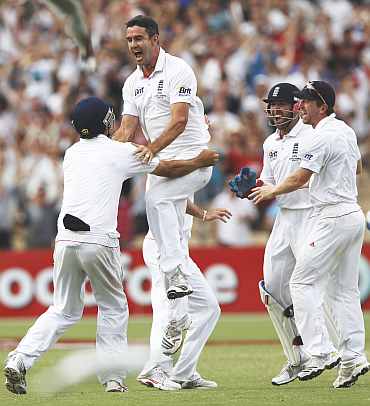 Kevin Pietersen celebrates after picking up Michael Clarke during the second Ashes Test in Adelaide