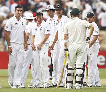 England players wait for the umpire's decision during the second Ashes Test in Adelaide