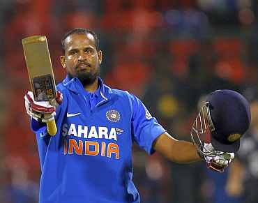 Yusuf Pathan celebrates after making a century against New Zealand in Bangalore