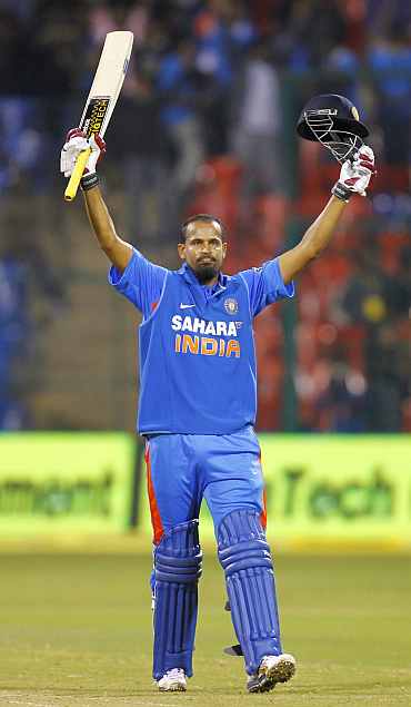 Yusuf Pathan reacts after hitting a century against New Zealand in Bangalore