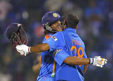 Saurabh Tiwary and Yusuf Pathan celebrate after winning the match against New Zealand in Bangalore