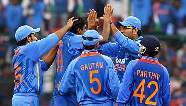 Indian team celebrates after picking up a wicket