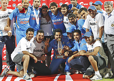 Members of Indian cricket team pose with the trophy after winning the series against New Zealand in Chennai on Friday