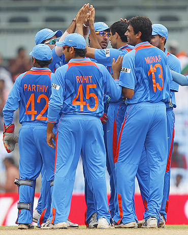 Indian players celebrate after the dismissal of New Zealand's Brendon McCullum in Chennai on Friday