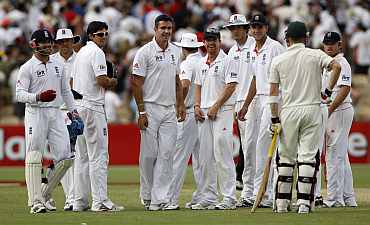 England players react to the dismissal of Australia's Michael Clarke