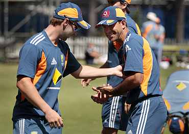 Australia's Phillip Hughes and Ricky Ponting joke around during a practice session ahead of the third Ashes Test in Perth