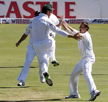 South Africa's Dale Steyn celebrates after picking up India's Virender Sehwag during the first Test match at Centurion