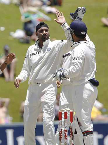 India's Harbhajan Singh celebrates after picking up South Africa's Graeme Smith during the first Test at Centurion