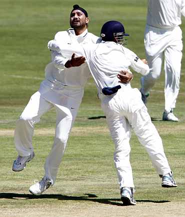 India's Harbhajan Singh celebrates after picking up South Africa's Alviro Petersen