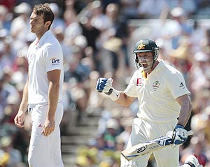 Australia's Mike Hussey (right) celebrates after scoring a century against England on Saturday