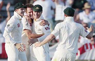 Australia's Ryan Harris (2nd from left) celebrates with teammates after dismissing England's Paul Collingwood
