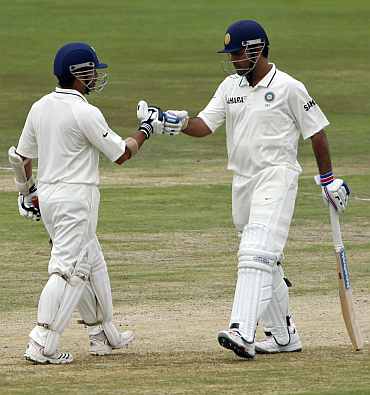 India's MS Dhoni and Sachin Tendulkar reacts during the fourth day of their first Test match against South Africa in Pretoria